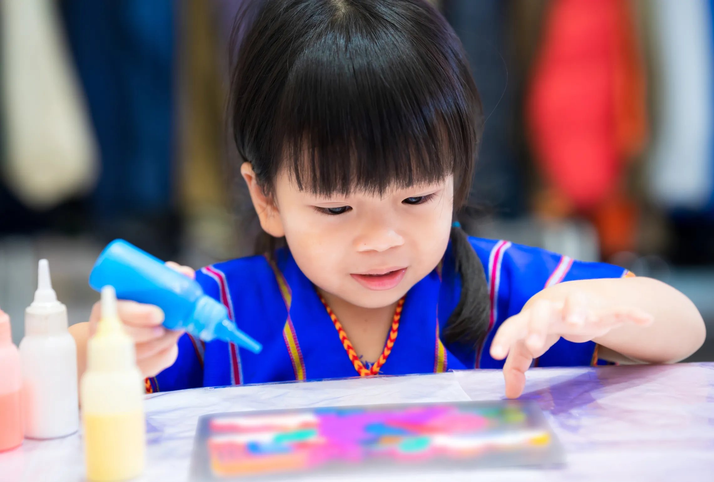 little girl doing arts and crafts