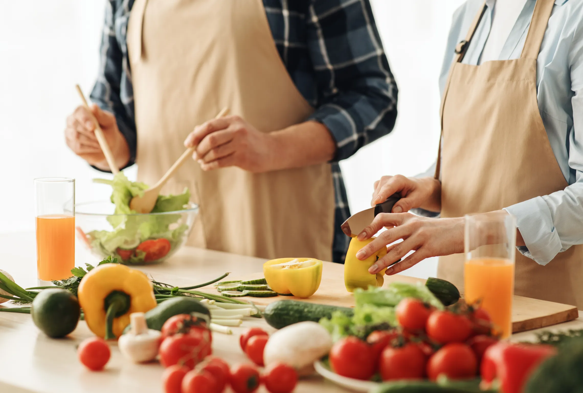 closeup of two people cooking