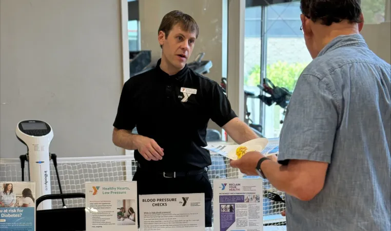 a man learns about programming for seniors at the Y