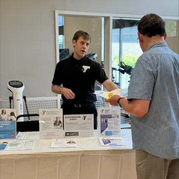 a man learns about programming for seniors at the Y